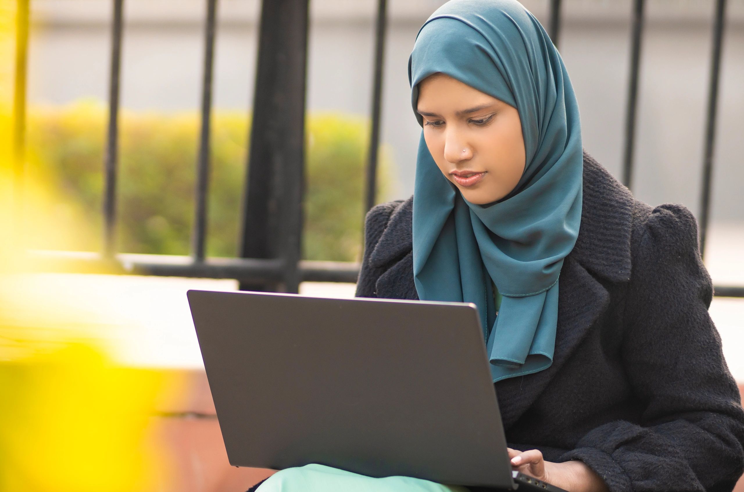 Student studying online on a laptop